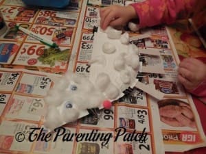 Adding Cotton Balls to the Arctic Fox Paper Plate Craft