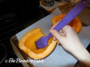 Brushing the Pumpkin with Olive Oil for Coconut Milk Pumpkin Soup