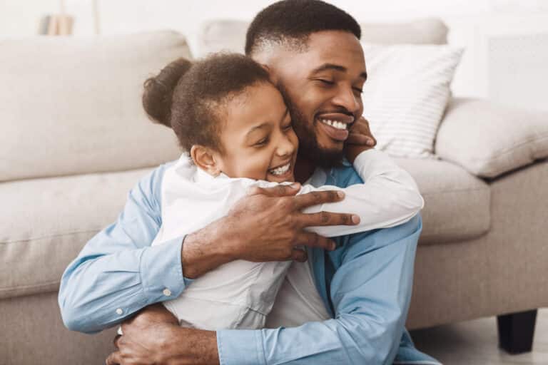 Daughter hugs father in bonding moment