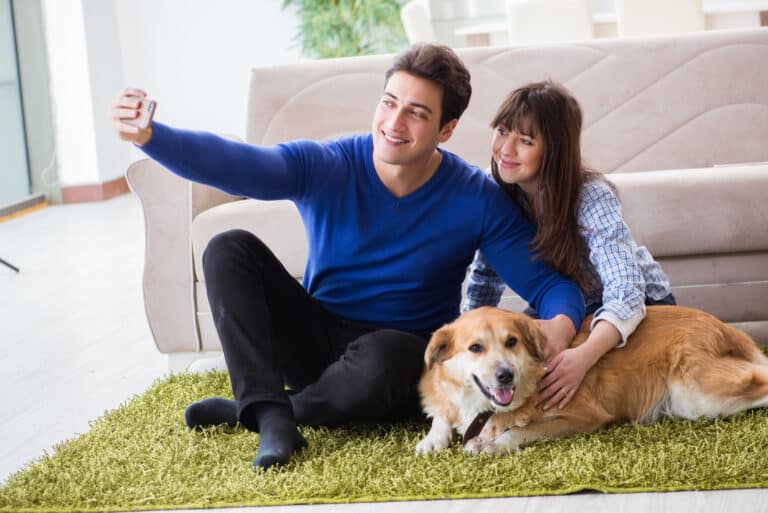 Happy family with golden retriever dog