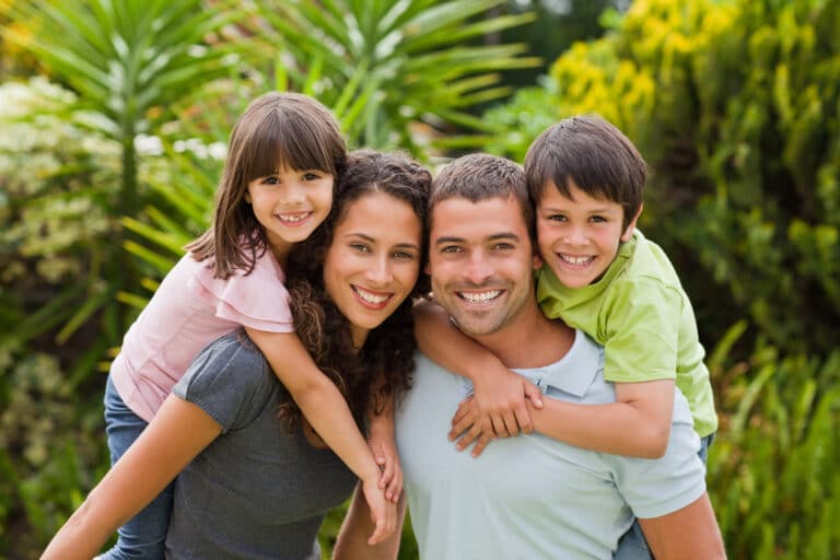 Parents give kids piggyback rides