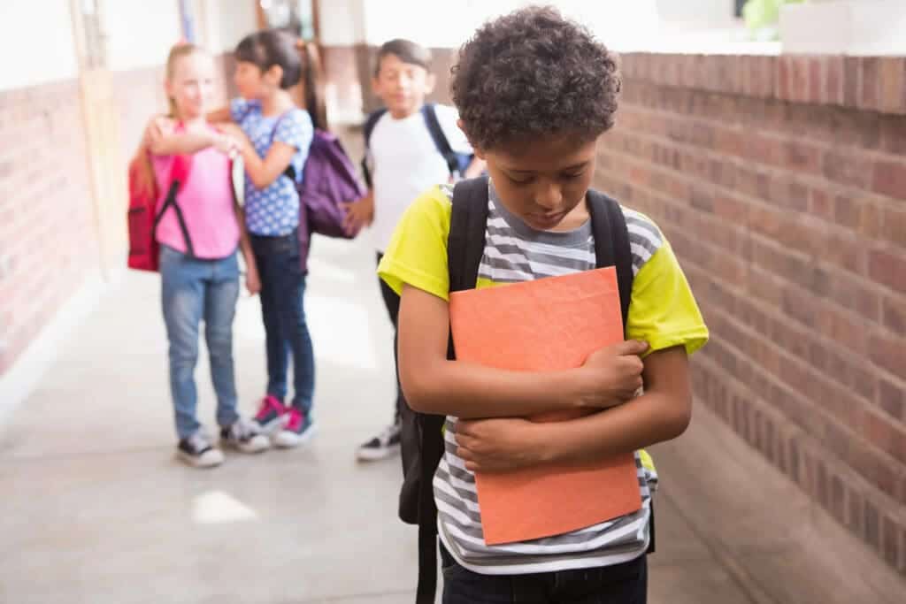 Boy being bullied by crowd