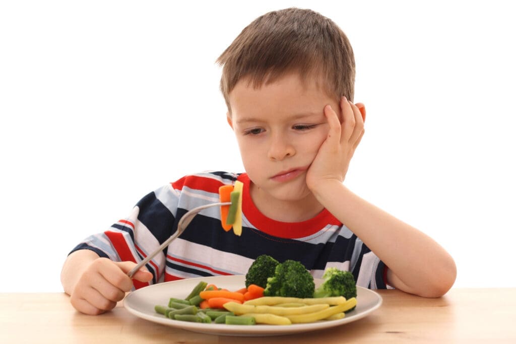 Boy eating carrots