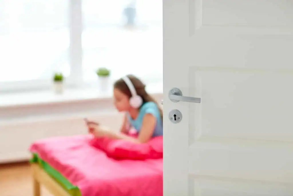 girl in headphones listening to music at home