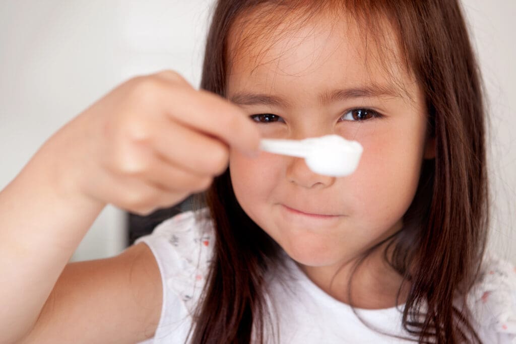 Young girl Measuring Ingredient