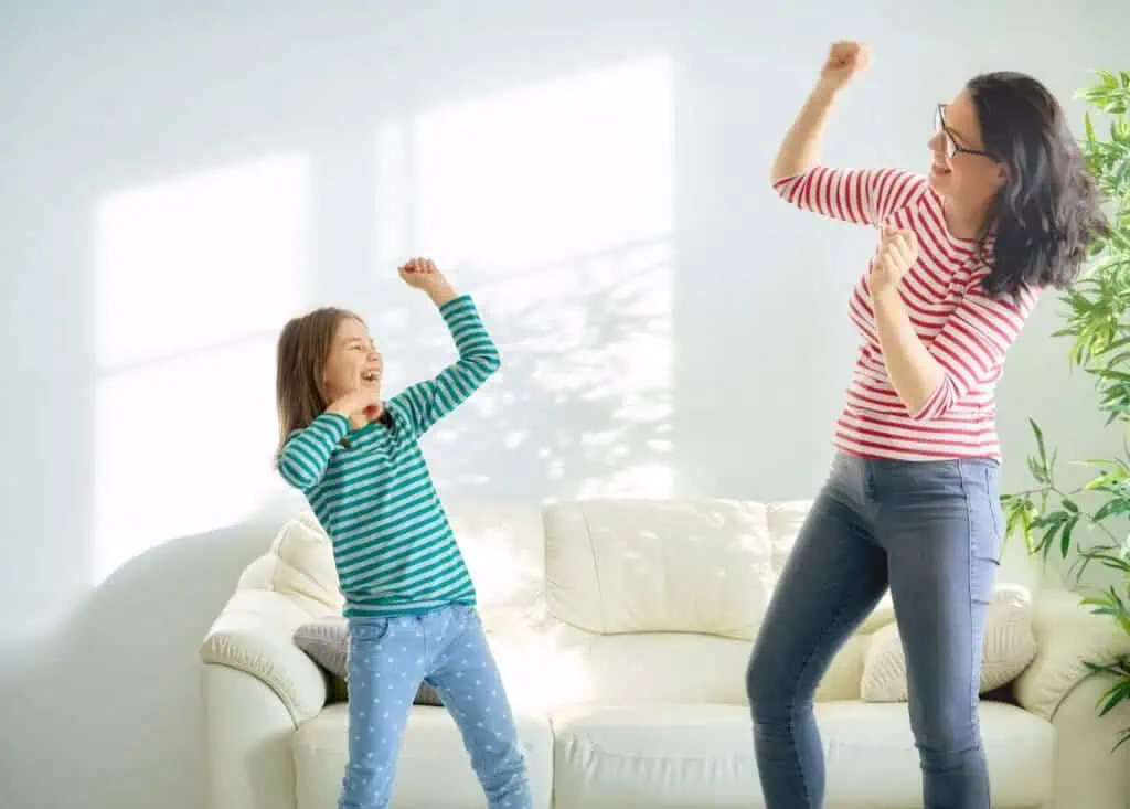 Happy loving family. Mother and her daughter child girl playing and dancing together