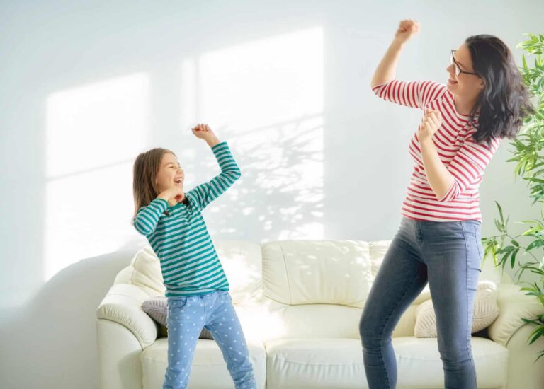 Happy loving family. Mother and her daughter child girl playing and dancing together