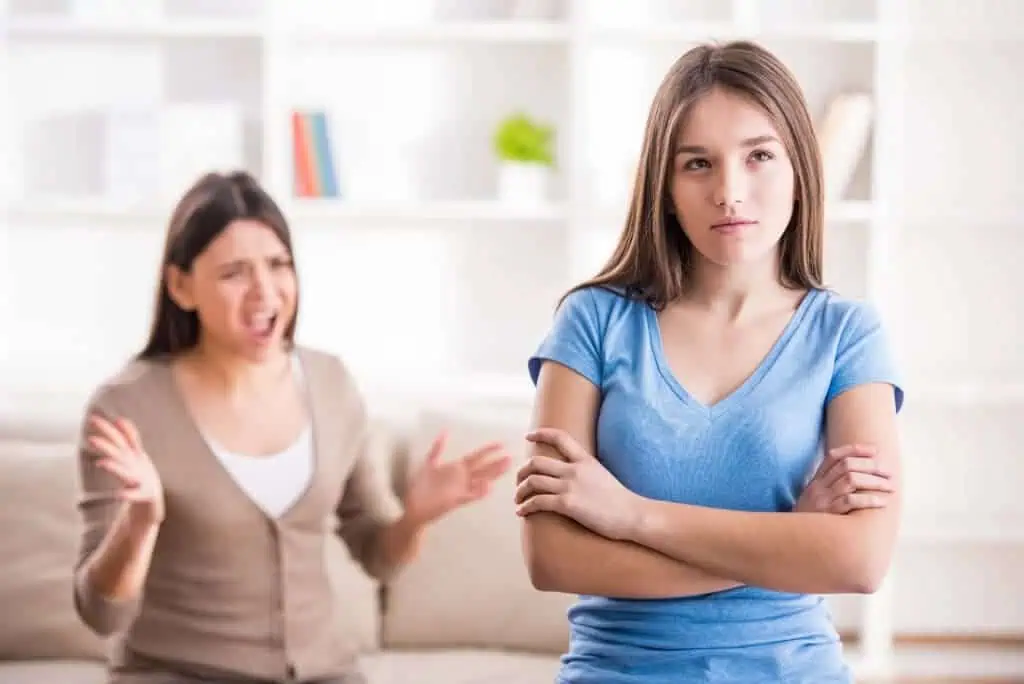 Mother scolding annoyed teen daughter