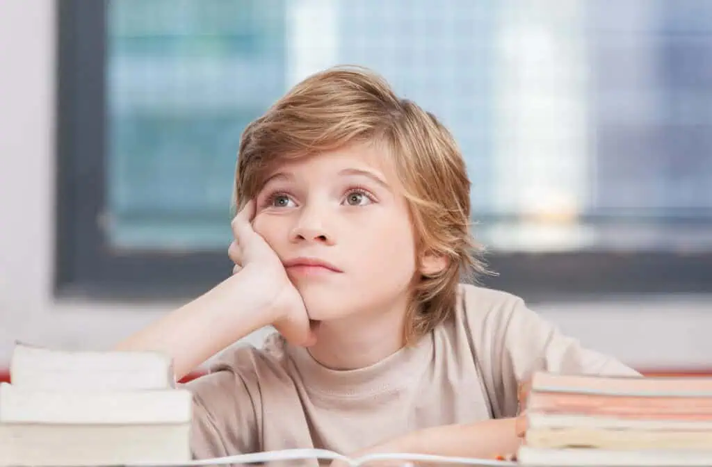 child is distracted and daydreaming in class