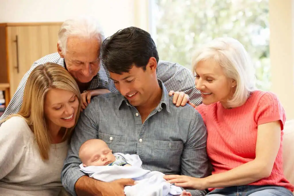Parents and grandparents greet newborn baby