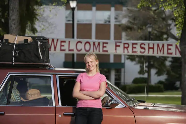 Young woman arrives at college with luggage
