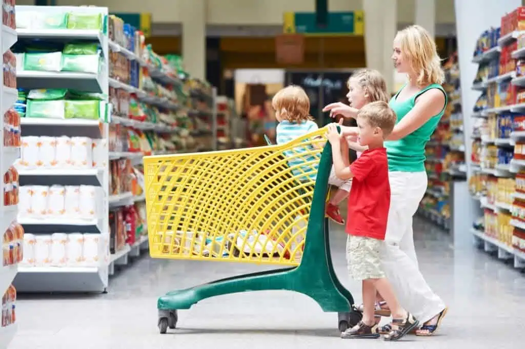 Woman takes three children shopping