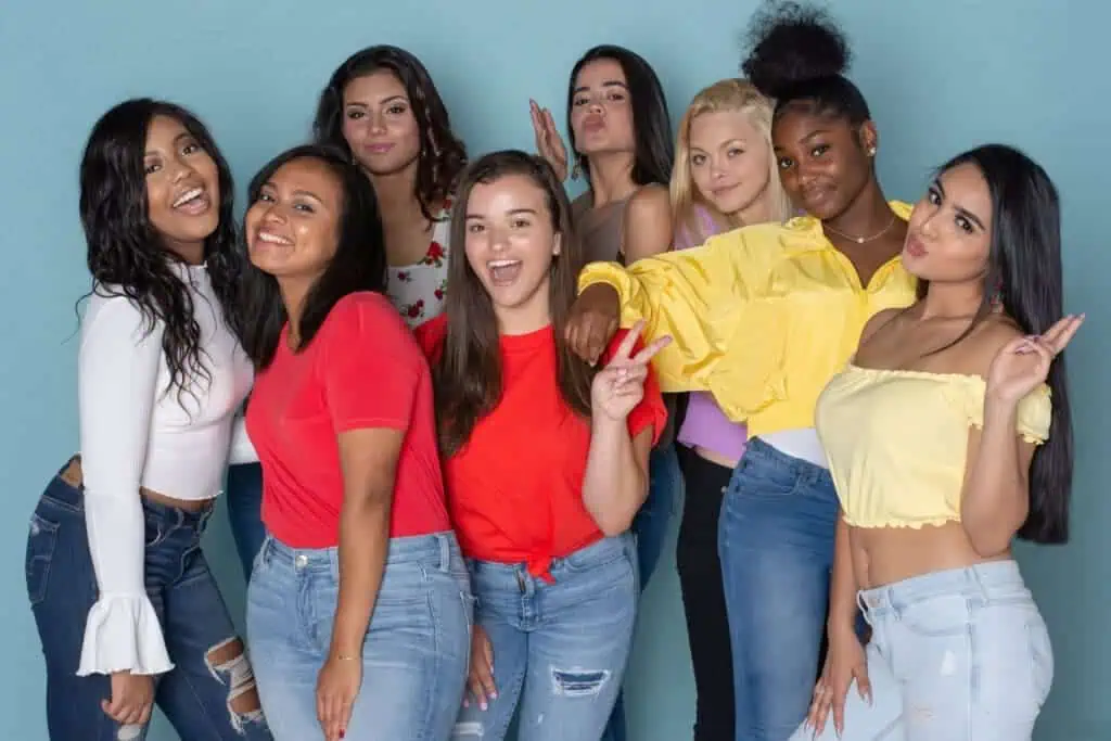 A group of diverse happy teen friends hanging out together