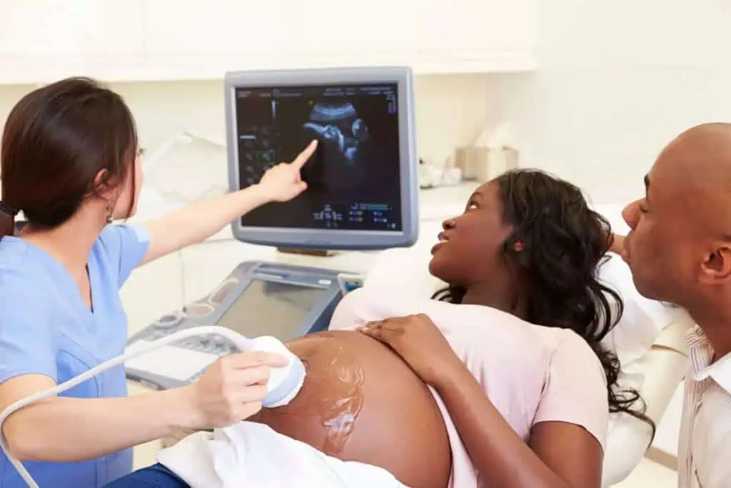 Pregnant woman watching ultrasound