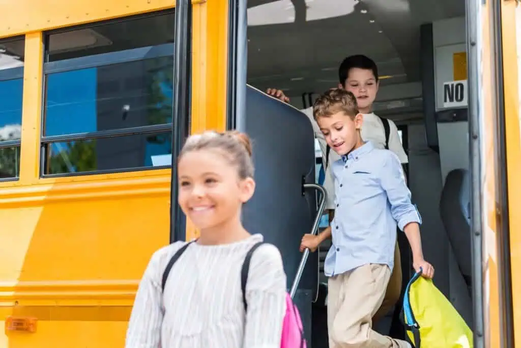 Kids exit school bus after long day