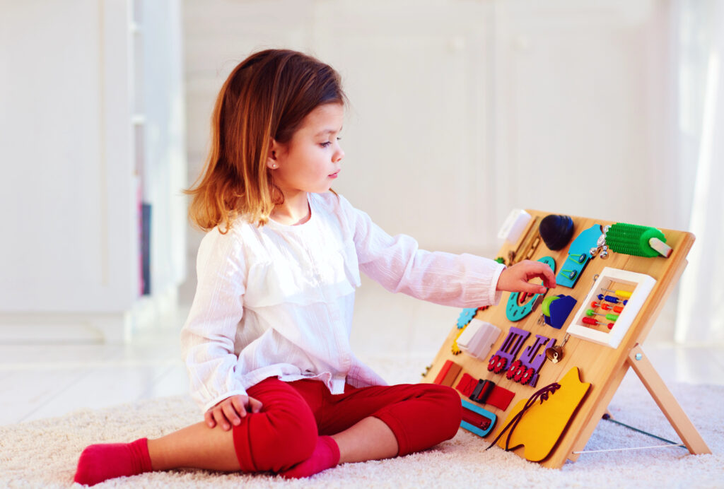 Child plays with buys board