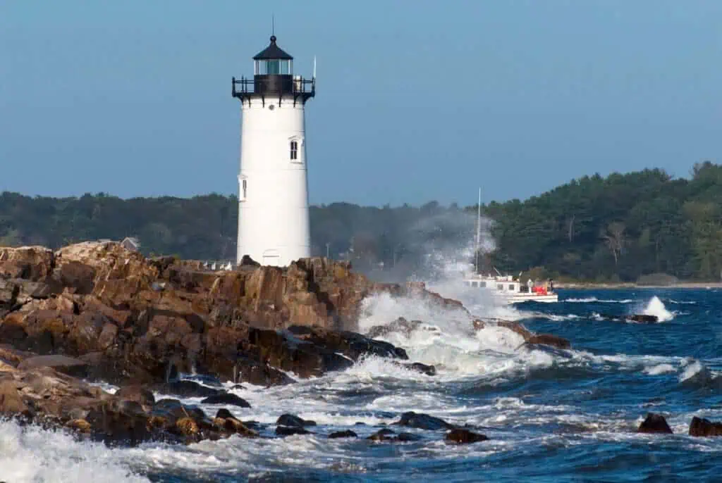 Portsmouth Lighthouse Guiding Fishing Boat in Rough Surf