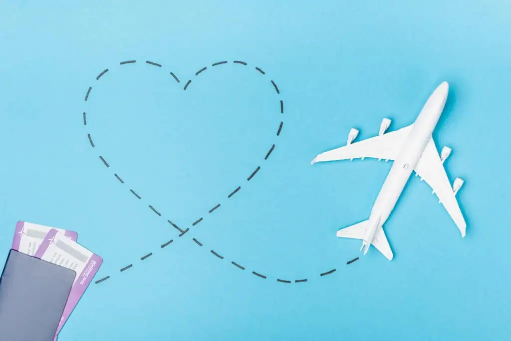 model airplane, and tickets with a heart