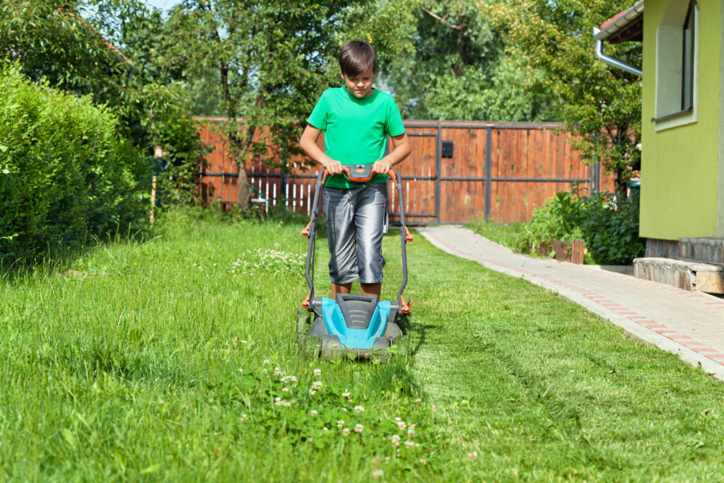 Child cutting the grass