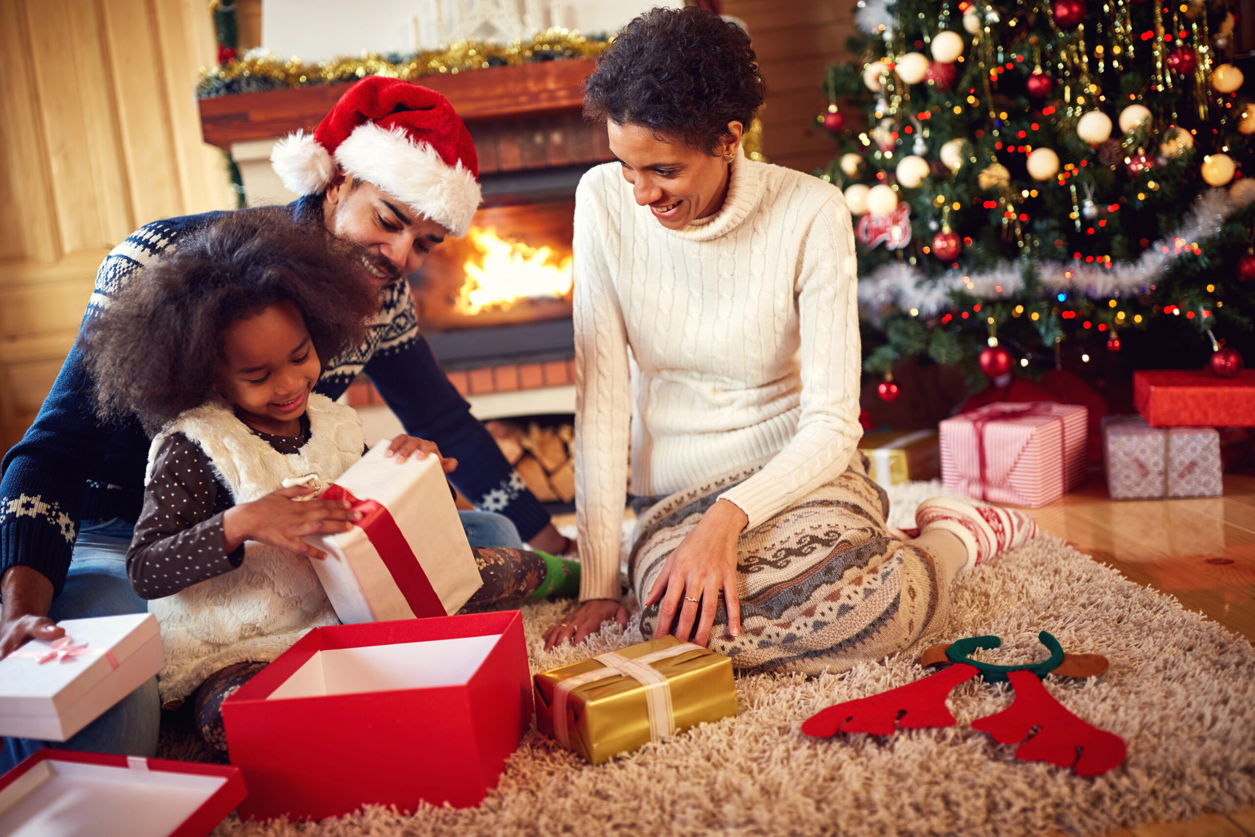family opens christmas presents