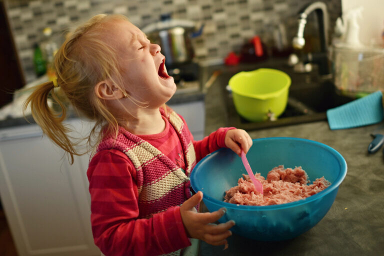 Child is crying over bowl of food