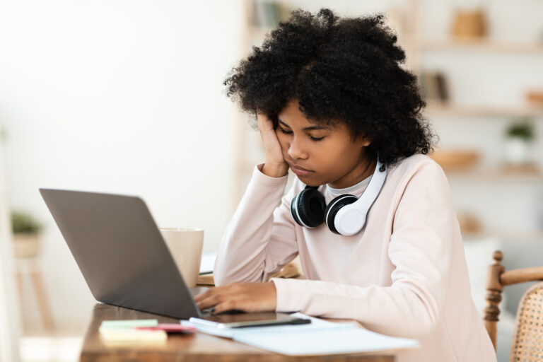 teen is overwhelmed and bunt out at computer