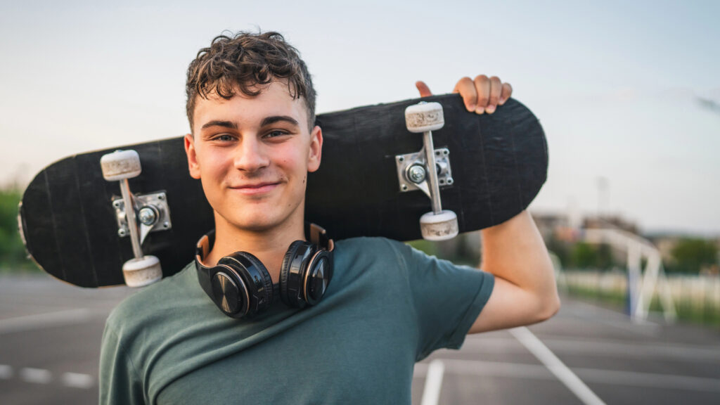 Teen boy with skateboard
