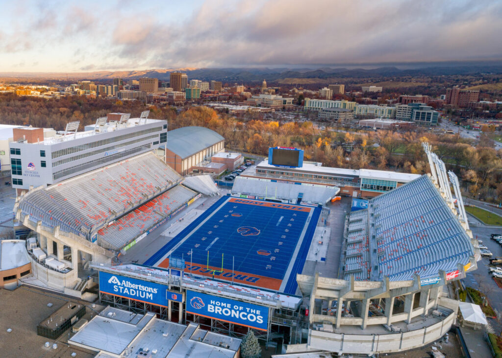 Unique blue Boise State football field aerial with Boise skyline