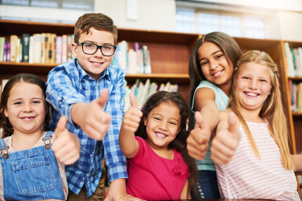 Kids gather in school library for learning