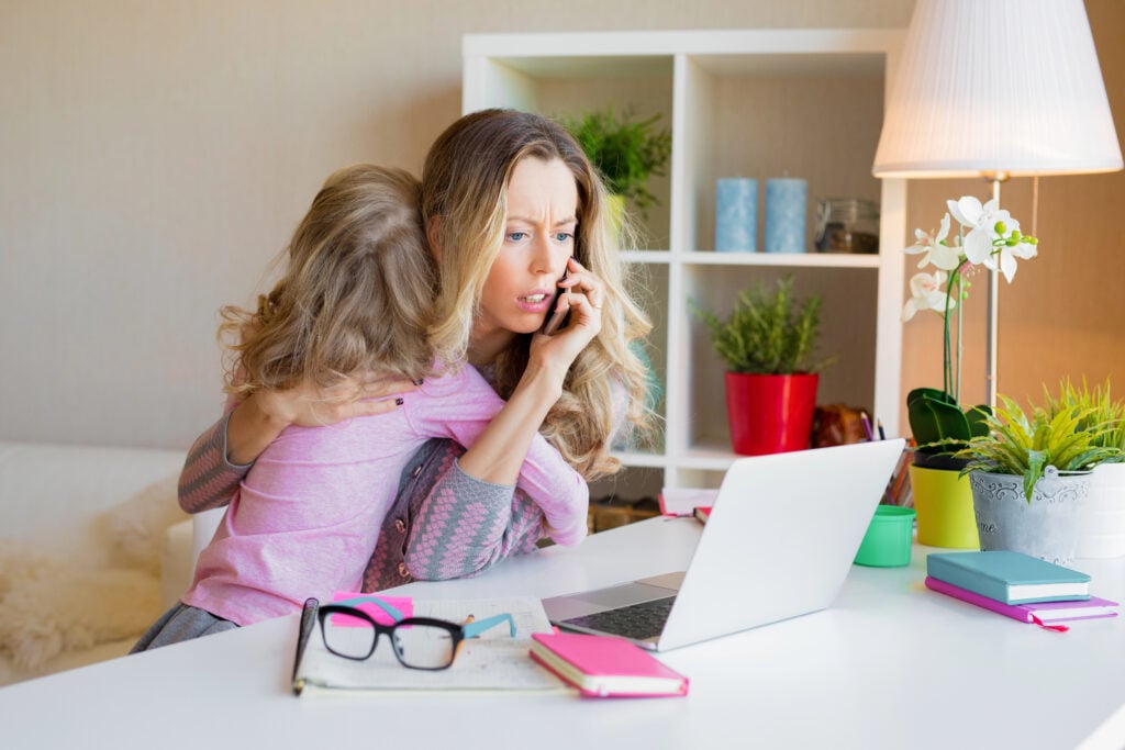 Mom is trying to work and balance childcare at the same time