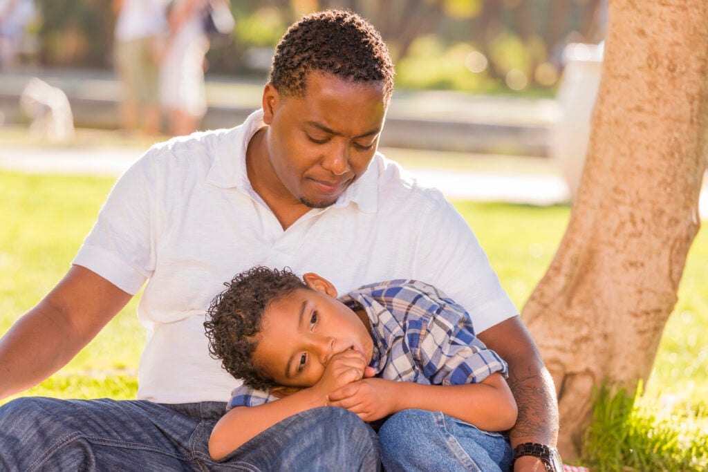 Dad soothes his frustrated son