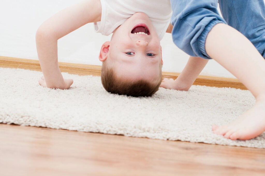 Kid standing upside down