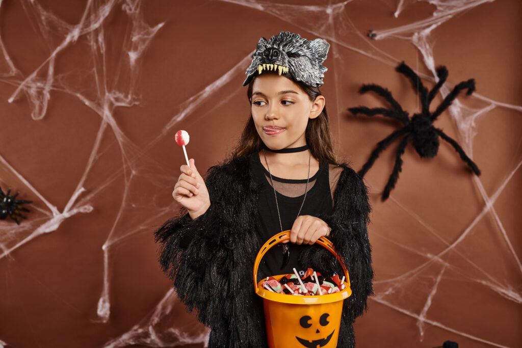 Girl eyes candy critically on Halloween in costume