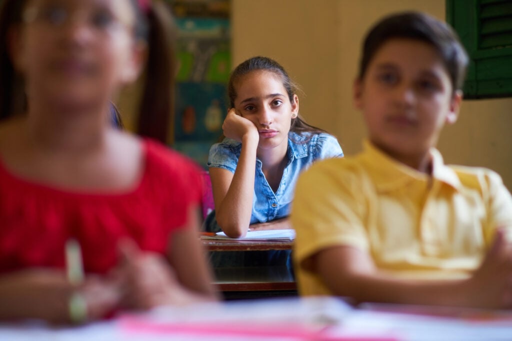 Kids sitting in class unhappy