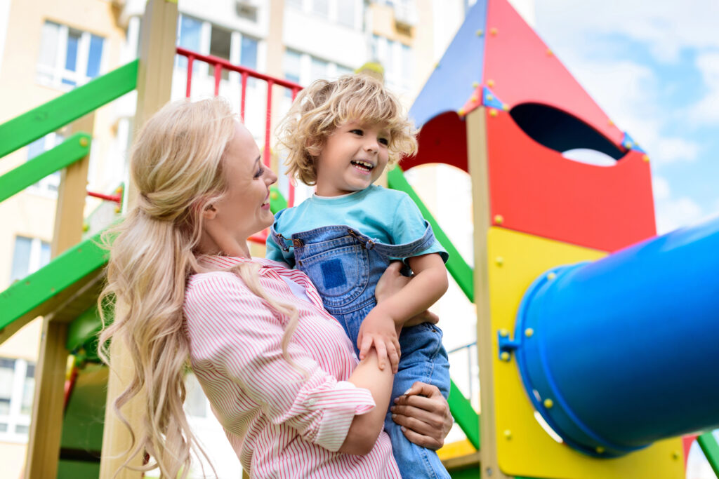 Mom takes child to playground