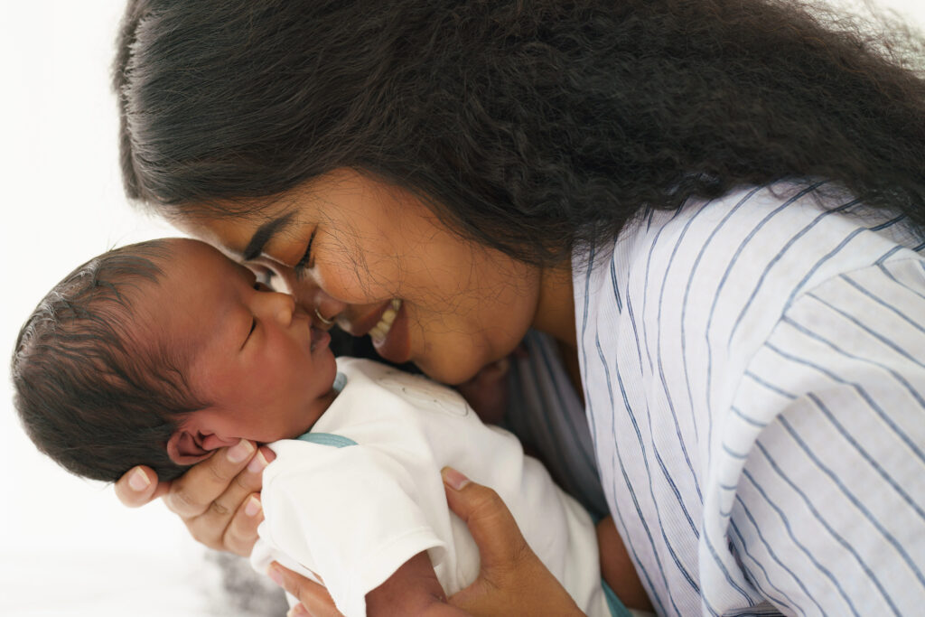 Mom loves her newborn healthy baby.