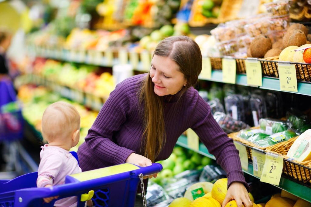 Mother and baby daughter in supermarket