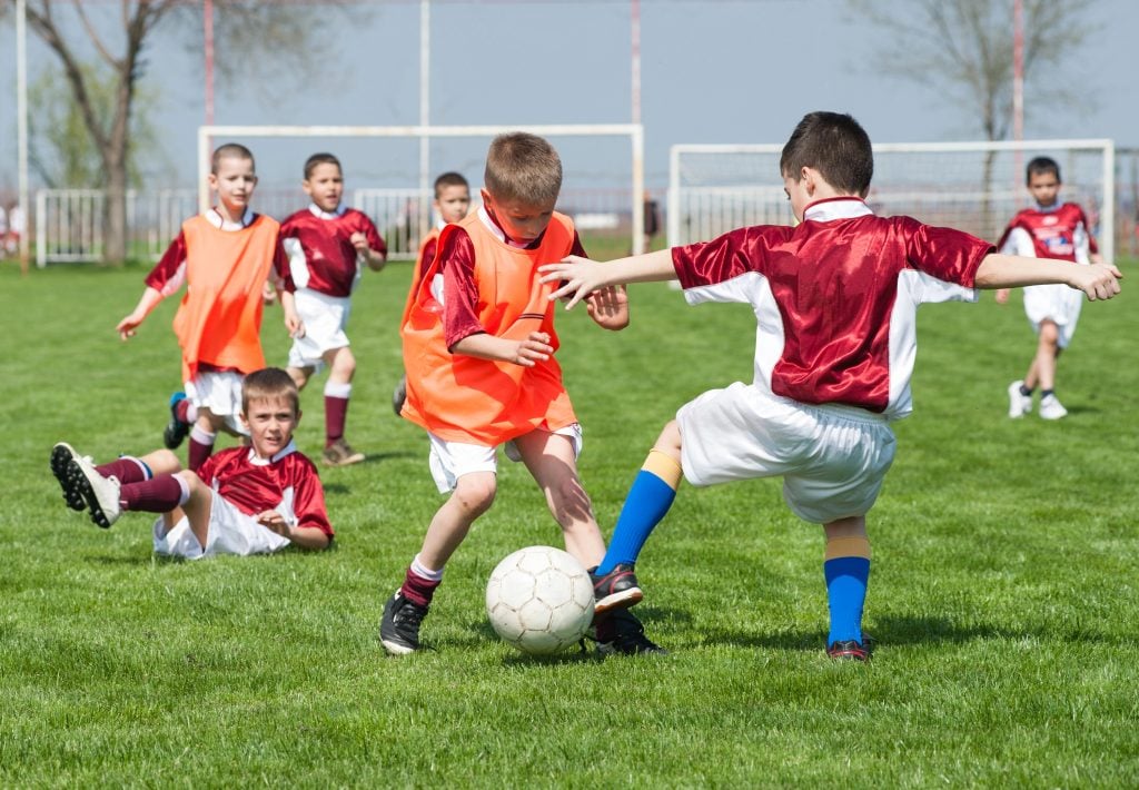 children playing soccer