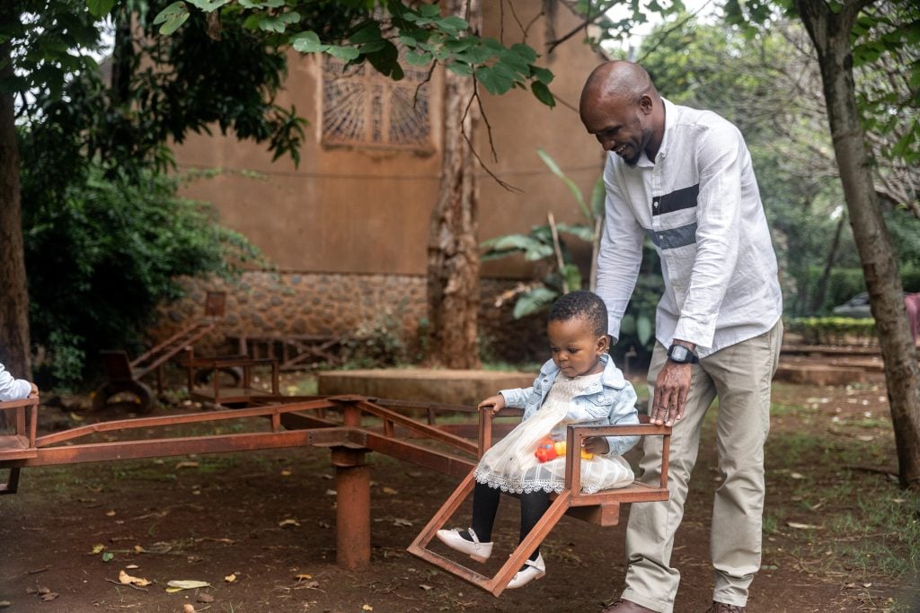 A gentle dad playing with his precious daughter.