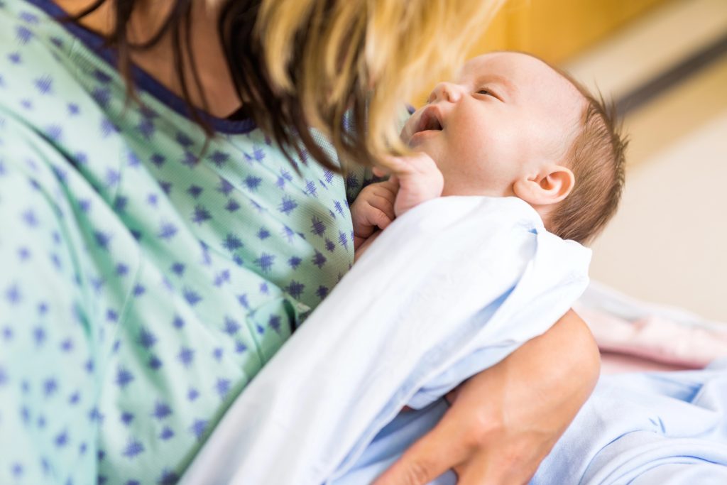 Babygirl Being Carried By Mother In Hospital