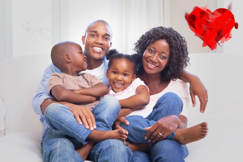 happy family posing on the couch together