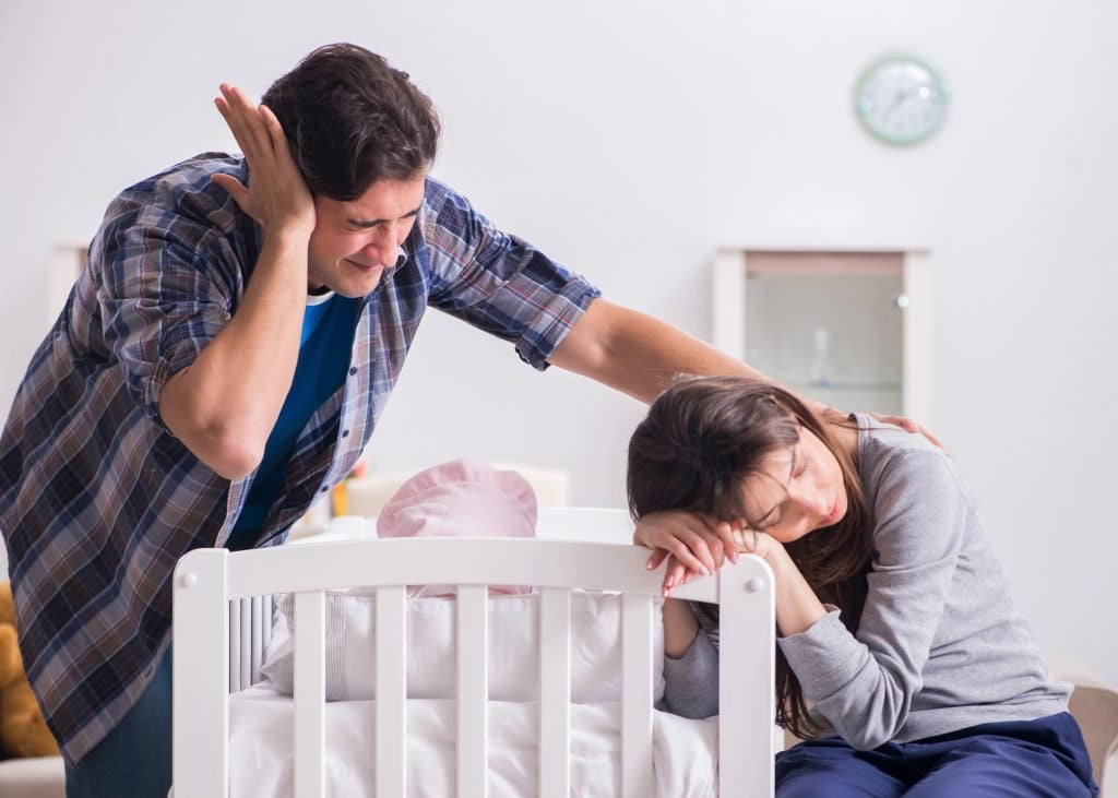 The young dad cannot stand baby crying