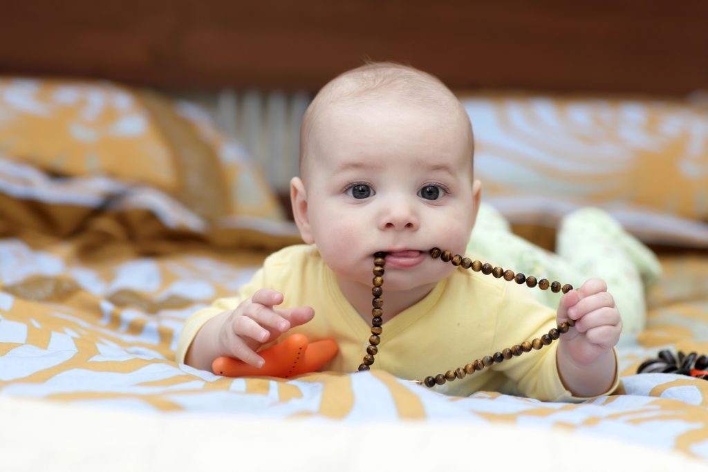 Baby with beads