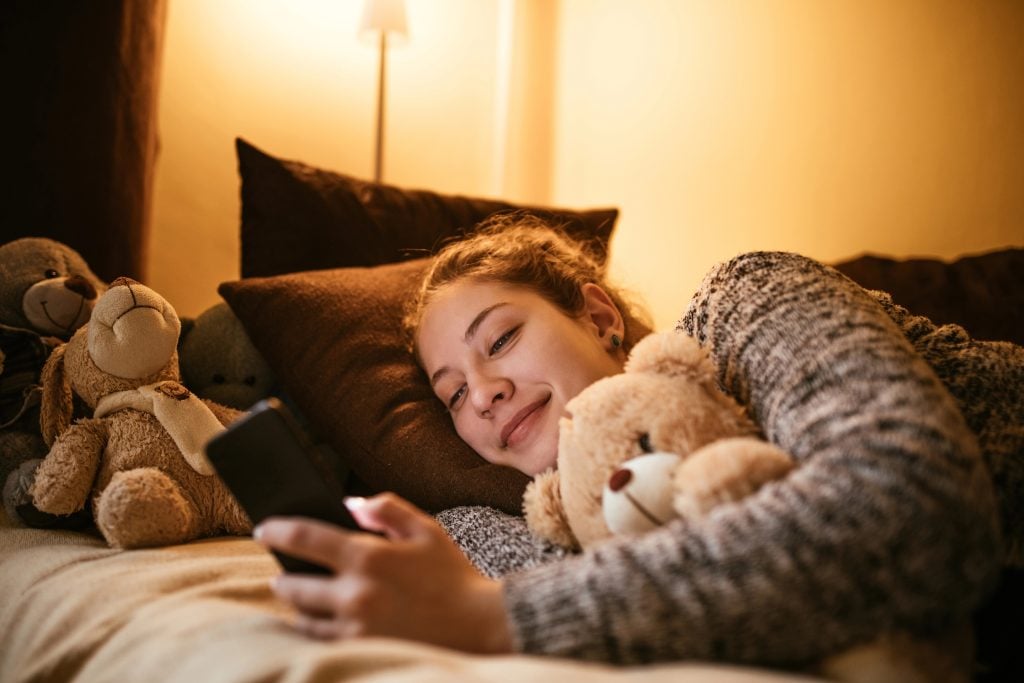 teen girl with phone using phone