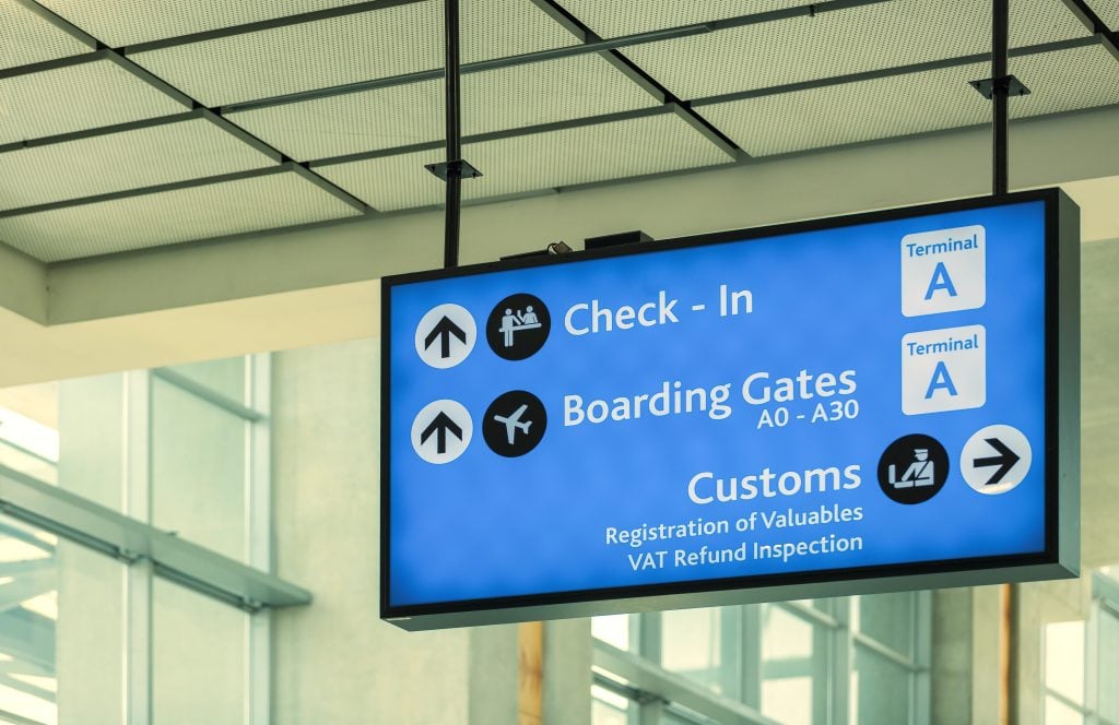 Info sign at international airport - Directions for check in and boarding gates - Registrations and custom at terminal connections