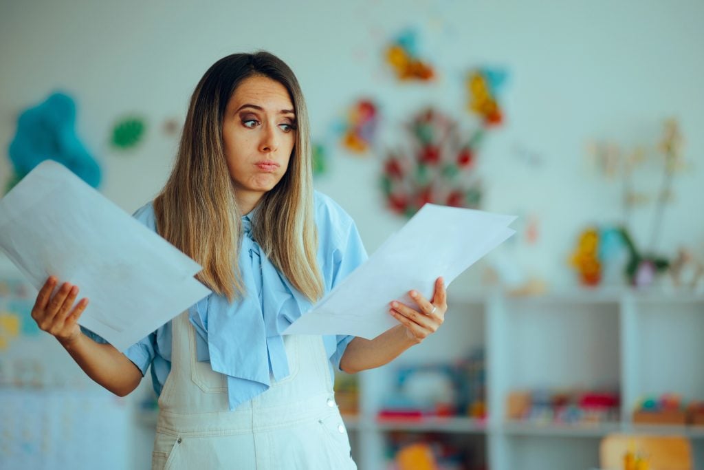 Busy Teacher Checking all the Projects Kids Made