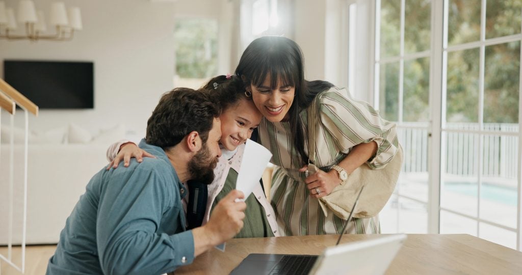 Excited, school report and parents with child in home for score, good grades and exam results. Bonding, family and happy mom, dad and girl hug with card for education, learning success and support.