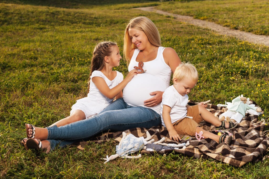 Pregnant woman with her kids