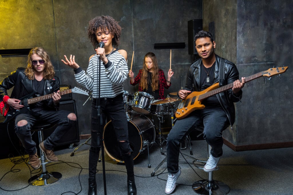 Rock band rehearsing in studio