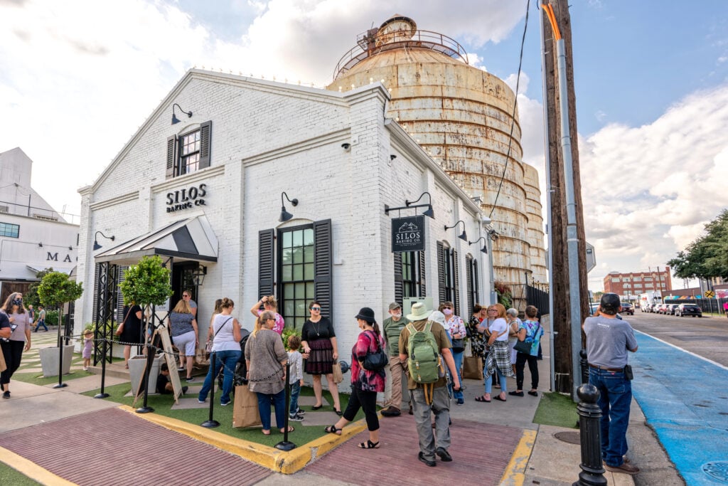 Waco, TX - Oct 21, 2021:Line of customers waiting to get into the Silos Baking Co. bakery at HGTV Fixer Upper stars Chip and Joanna Gaines' downtown complex.